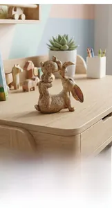Macro view of modern resin rabbit statue with realistic wood grain texture for home decor