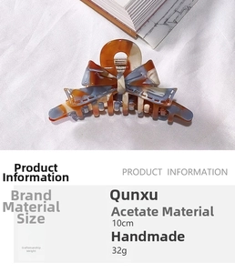 Detail view of 10cm acetate bow hair claw clip with marble pattern and size specifications