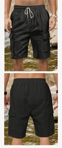 Detail of black cargo shorts with elastic drawstring waist and side flap pockets