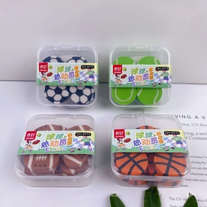 Macro view of four ball-shaped erasers including soccer, tennis, rugby and basketball