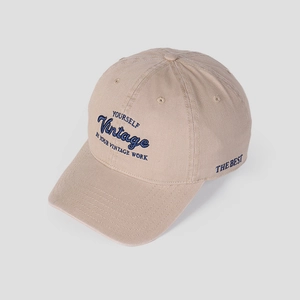 Detailed view of khaki cotton baseball cap with vintage navy blue embroidery lettering