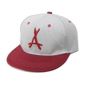 Detail of red 3D letter A embroidery on off-white and red flat brim snapback cap