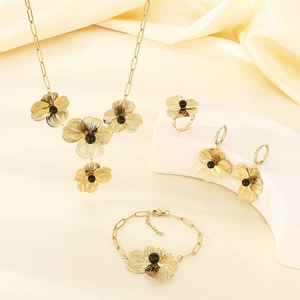 Vintage gold hollow flower jewelry set with necklace, bracelet, ring and earrings