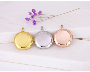 Polished round lockets in gold, silver, and rose gold on a marble background with flowers