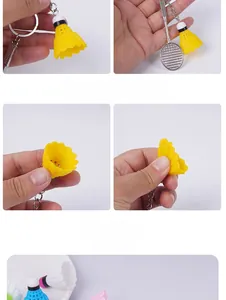 Detailed macro view showing the flexible shuttlecock and alloy badminton racket keychain