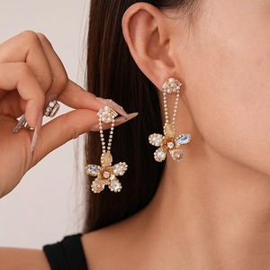 Elegant floral pearl earrings with zircon diamonds and gold tassels for women