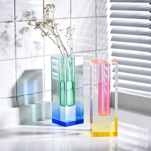 Modern gradient acrylic vases with rectangular shape and natural light play on tile wall