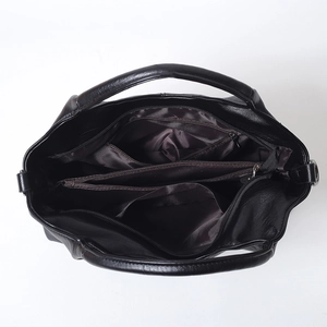 Black soft leather handbag interior view showing large capacity and zipper compartments