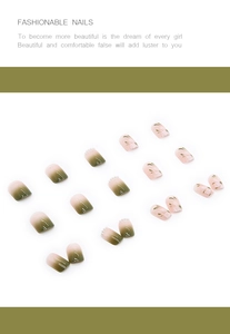 Detail of green gradient press-on nails with white pearls and floral leaf patterns
