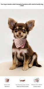 Detail of strawberry print dog bandana collar with durable beige plastic buckle