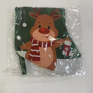 Detail of Christmas stocking with cartoon reindeer and snowflake pattern in plastic bag