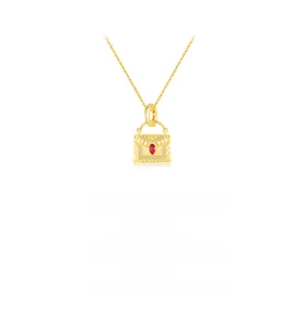 Gros plan du pendentif sac à main en argent S925 doré avec pierre rouge et diamants
