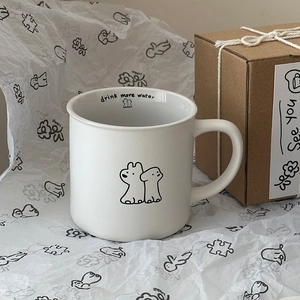 Minimalist white ceramic puppy mug with Drink More Water print and kraft gift box