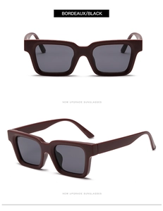 Close-up of square Bordeaux red frame sunglasses with black lenses and thick matte temples