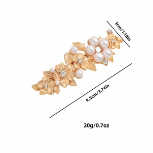 Golden vintage rose spring hair clip with pearls and rhinestones on white background