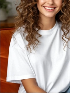 Detail of white cotton crewneck t-shirt showing collar texture and relaxed fit style