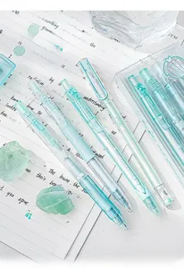 Close-up of translucent mint green glitter gel pen showing internal structure and ink refill