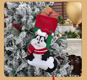 Christmas stocking featuring a 3D husky dog design hanging on a festive decorated tree