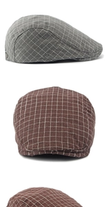 Close-up of vintage cotton plaid newsboy caps in grey and brown textured fabrics