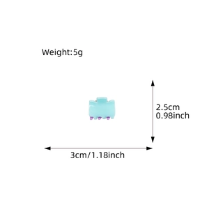 Mini candy-colored light blue hair claw clip with size and weight dimensions shown