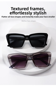 Detail shot of square oversized sunglasses in black and translucent grey-purple frames