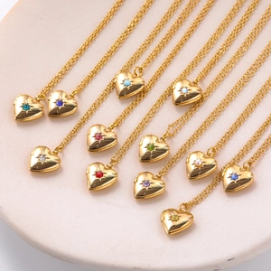 Detail of heart locket necklaces with various birthstones in starburst settings