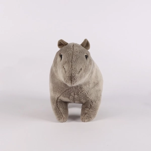 Close-up of soft plush fabric and detailed stitching on the brown capybara stuffed toy