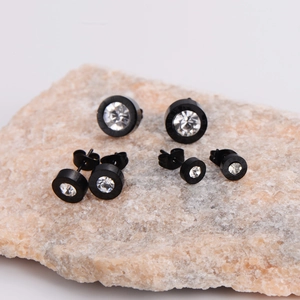 Black round stainless steel stud earrings with crystals in three different sizes