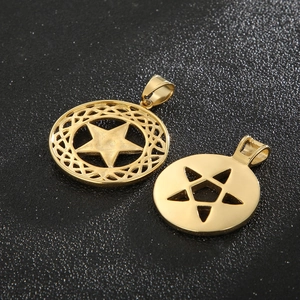 Macro shot of 18K gold plated stainless steel star pendants with intricate hollow weave texture