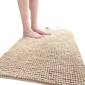 Absorbent beige chenille bath mat with anti-slip texture and soft microfiber surface