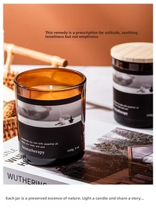 Detailed shot of an amber glass jar aromatherapy soy wax candle in a cozy home setting