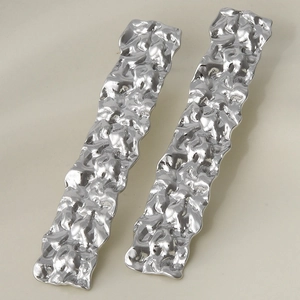 Close-up of long rectangular 304 stainless steel earrings with hammered texture