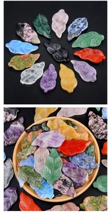 Detailed view of hand-carved leaf-shaped crystal and agate stones in diverse natural colors