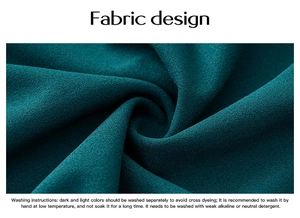 Detail of dark green fabric texture with elegant draping and English care instructions