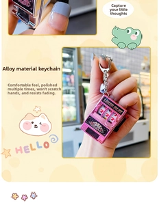 Detail of pink alloy lucky slot machine keychain showing the movable lever and metal chain