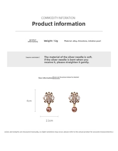 Macro shot showing dimensions and weight of vintage gold hollow earrings with pearls