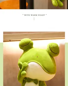 Close-up of cute green frog plush toy with bow tie and soft warm lighting
