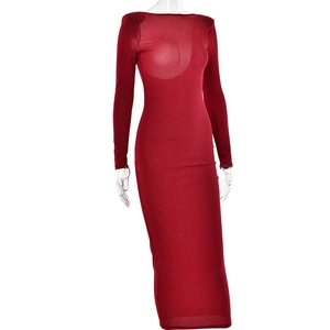 Detail view of red glitter off-shoulder dress fabric and elegant slim fit tailoring