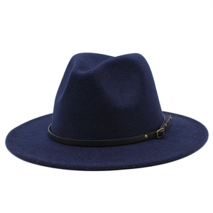 Detailed close-up of dark blue wool fedora hat with black leather band and gold buckle