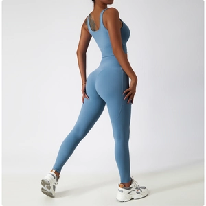 Detail of light blue high-waisted yoga pants with functional side phone pocket and seamless fit