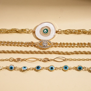 Lot de 5 bracelets bohèmes dorés avec breloques œil protecteur et strass brillants