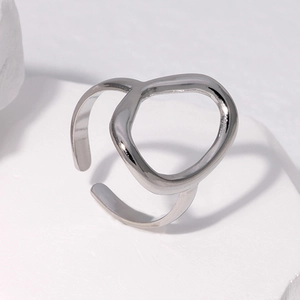 Detail of adjustable silver ring featuring irregular organic twisted metal lines