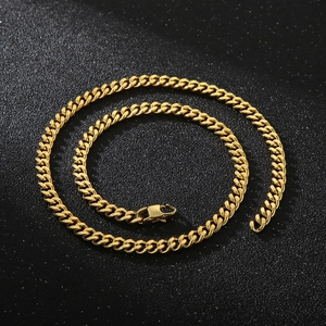 Detailed view of gold plated titanium steel Cuban link chain with secure lobster clasp