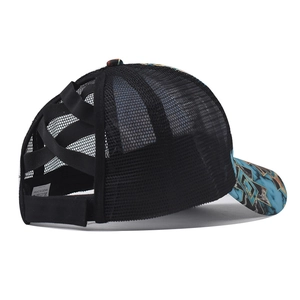 Detail of cross-back elastic bands on black mesh ponytail hat with marble print brim