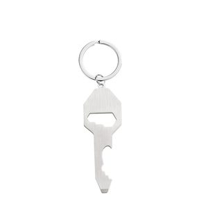 Close-up of a brushed stainless steel key-shaped bottle opener keychain on a white background