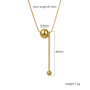 Collier minimaliste en titane plaqué or 18k avec pendentif boule et barre géométrique