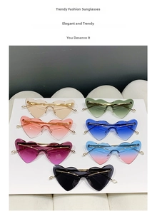 Detailed flat lay of heart-shaped rimless sunglasses in seven vibrant fashion colors