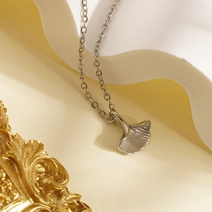 Minimalist silver ginkgo leaf pendant necklace in stainless steel with textured finish