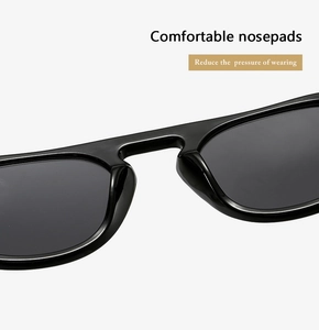 Detail of comfortable integrated nose pads on black round frame sunglasses for pressure relief
