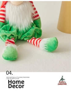 Macro detail of Christmas gnome plush showing red and white stripes and green faux fur texture